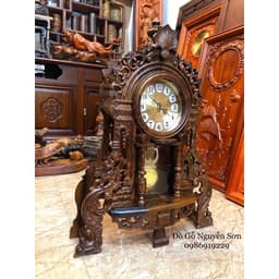Đồng hồ quả lắc để bàn gỗ mun đuôi công 2