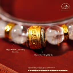 Ngọc Đan Tâm - Vòng Tay Thạch Anh Ưu Linh Trắng 8mm 2A Charm Hạt Trống Chữ Om 2