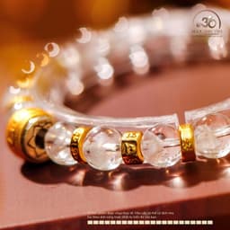 Ngọc Đan Tâm - Vòng Tay Thạch Anh Ưu Linh Trắng 8mm 2A Charm Hạt Trống Chữ Om 5