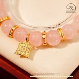 Ngọc Đan Tâm - Vòng Tay Thạch Anh Hồng 10mm 4A Phối Charm Bánh Xe Pháp Luân 5